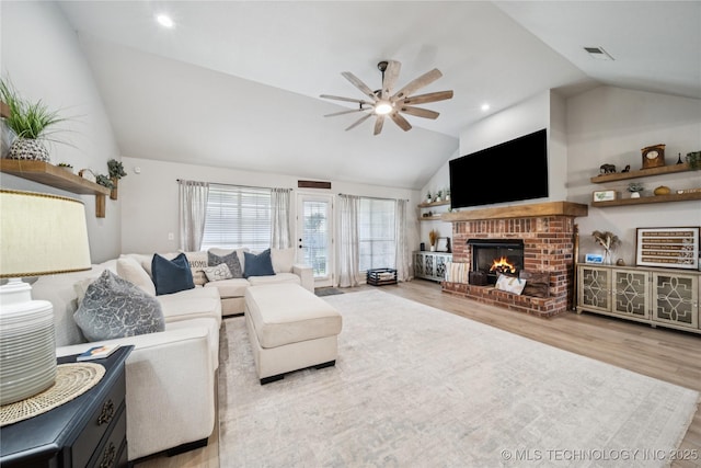 1112 N Yellowood Ave, Broken Arrow, OK 74012 - living room featuring ceiling fan, wood finished floors, a fireplace, and high vaulted ceiling