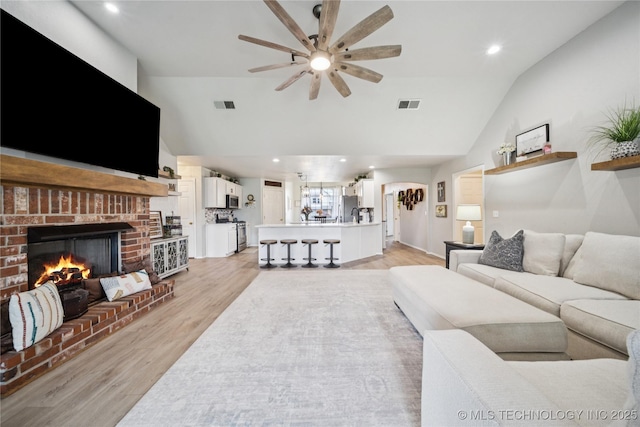 1112 N Yellowood Ave, Broken Arrow, OK 74012 - living area with a ceiling fan, light wood-type flooring, a fireplace, recessed lighting, and high vaulted ceiling