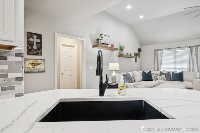 1112 N Yellowood Ave, Broken Arrow, OK 74012 - kitchen with light stone counters, lofted ceiling, open floor plan, white cabinets, and recessed lighting