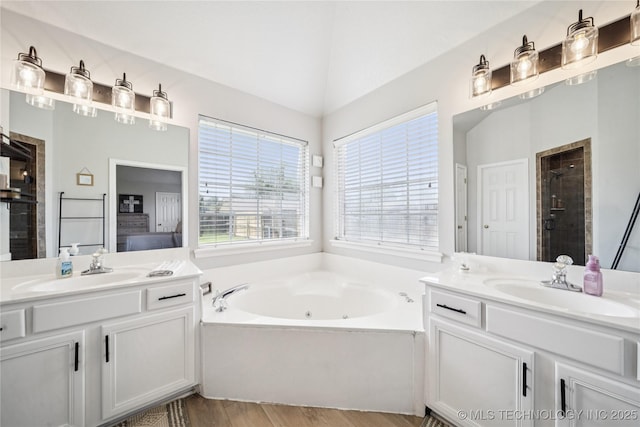 1112 N Yellowood Ave, Broken Arrow, OK 74012 - bathroom with a whirlpool tub, two vanities, wood finished floors, a shower stall, and lofted ceiling