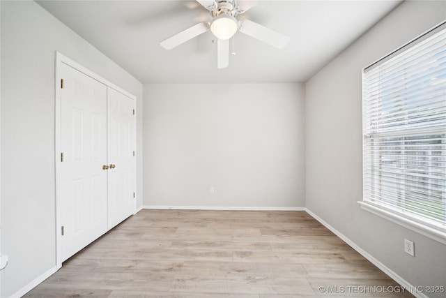 1112 N Yellowood Ave, Broken Arrow, OK 74012 - unfurnished bedroom featuring light wood-style floors, a closet, and ceiling fan