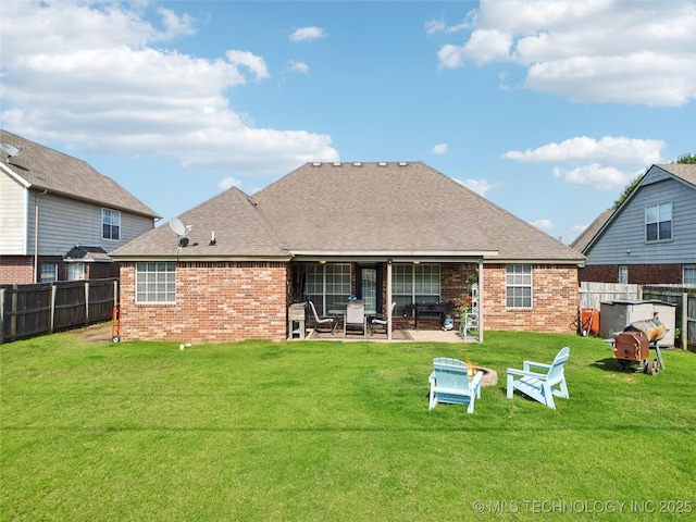 1112 N Yellowood Ave, Broken Arrow, OK 74012 - back of house with brick siding, a patio area, a fenced backyard, and a shingled roof
