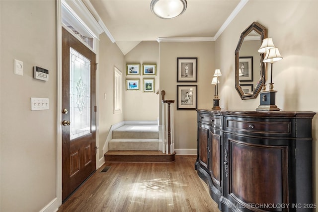 9632 S Vandalia Ave, Tulsa, OK 74137 - entrance foyer with dark wood-style floors, ornamental molding, stairway, and vaulted ceiling