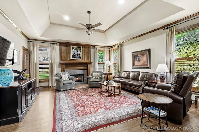 9632 S Vandalia Ave, Tulsa, OK 74137 - living area with a high end fireplace, wood finished floors, ceiling fan, and lofted ceiling