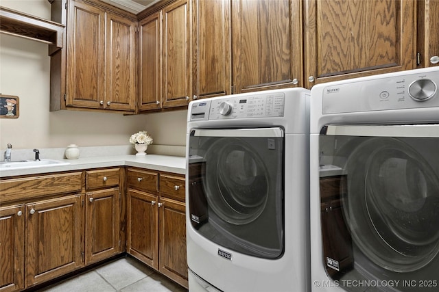 9632 S Vandalia Ave, Tulsa, OK 74137 - laundry room featuring cabinet space, separate washer and dryer, and light tile patterned flooring