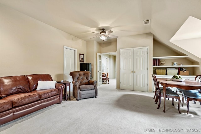9632 S Vandalia Ave, Tulsa, OK 74137 - living area featuring light colored carpet, a ceiling fan, and vaulted ceiling