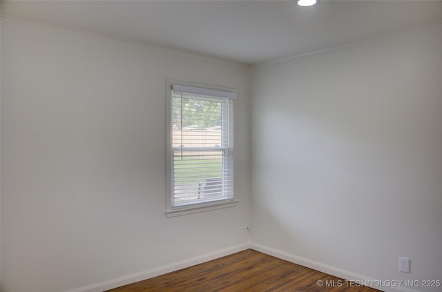 3634 S Pittsburg Ave, Tulsa, OK 74135 - spare room featuring dark wood-type flooring, crown molding, and recessed lighting