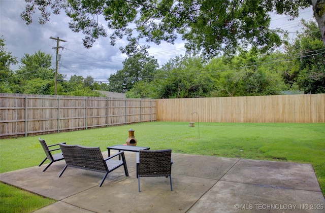 3634 S Pittsburg Ave, Tulsa, OK 74135 - fenced backyard featuring a patio area and outdoor dining area