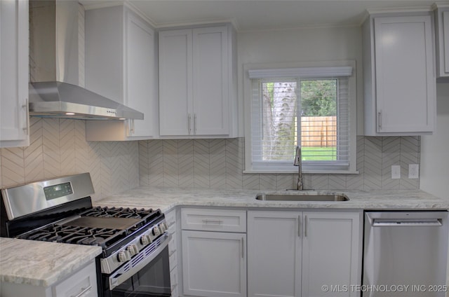 3634 S Pittsburg Ave, Tulsa, OK 74135 - kitchen featuring appliances with stainless steel finishes, wall chimney exhaust hood, decorative backsplash, light stone counters, and crown molding