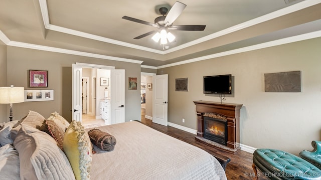 7920 N 147th E Ave, Owasso, OK 74055 - bedroom featuring a raised ceiling, a glass covered fireplace, crown molding, wood finished floors, and a ceiling fan