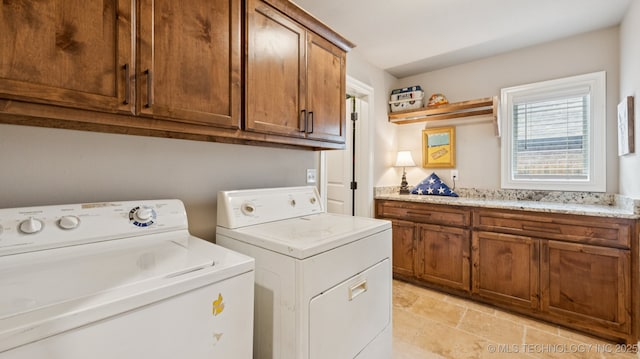 7920 N 147th E Ave, Owasso, OK 74055 - laundry room featuring independent washer and dryer, cabinet space, and light stone finish flooring