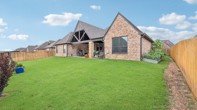 7920 N 147th E Ave, Owasso, OK 74055 - view of front of property featuring a fenced backyard, brick siding, and a shingled roof