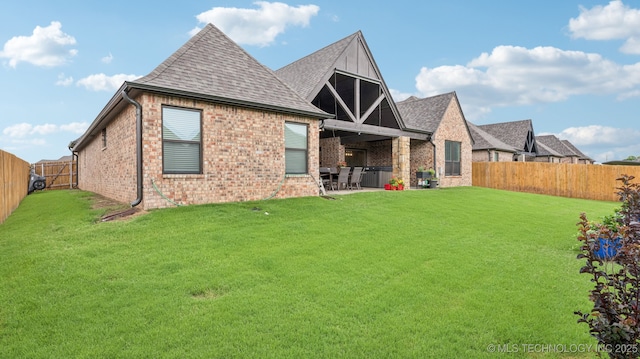 7920 N 147th E Ave, Owasso, OK 74055 - rear view of property with brick siding, a fenced backyard, a shingled roof, and a patio
