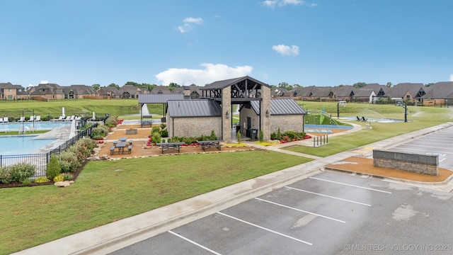 7920 N 147th E Ave, Owasso, OK 74055 - view of property with uncovered parking, a community pool, and a residential view