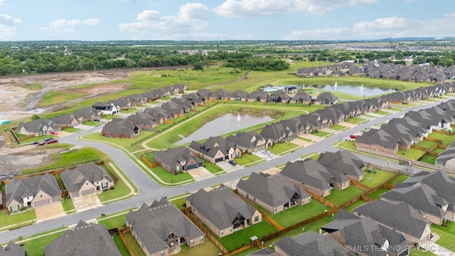 7920 N 147th E Ave, Owasso, OK 74055 - aerial view of property and surrounding area with nearby suburban area and a large body of water