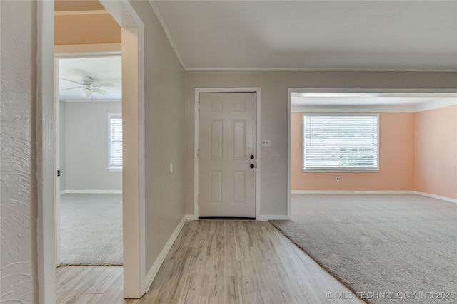 1417 Downing St, Oklahoma City, OK 73120 - carpeted foyer entrance with ornamental molding, wood finished floors, and a ceiling fan