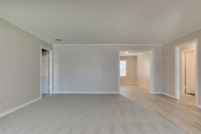 1417 Downing St, Oklahoma City, OK 73120 - spare room featuring ornamental molding and carpet floors