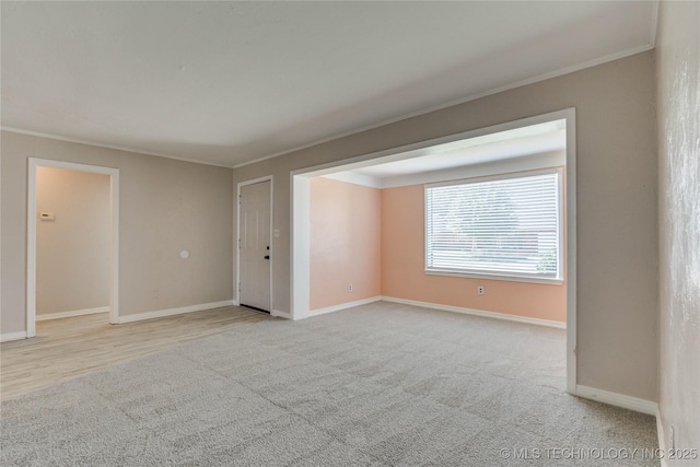 1417 Downing St, Oklahoma City, OK 73120 - spare room with ornamental molding and light carpet