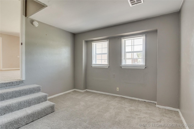 1417 Downing St, Oklahoma City, OK 73120 - empty room with light carpet and stairway