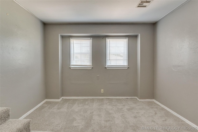 1417 Downing St, Oklahoma City, OK 73120 - spare room featuring carpet and baseboards