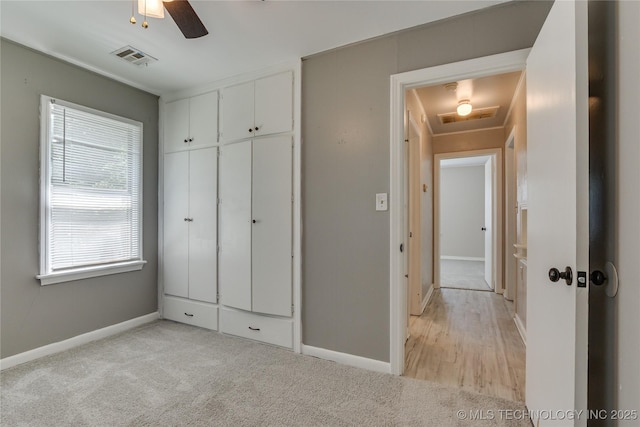 1417 Downing St, Oklahoma City, OK 73120 - unfurnished bedroom with light carpet, a closet, and ceiling fan