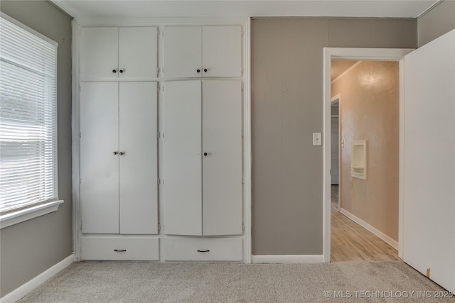 1417 Downing St, Oklahoma City, OK 73120 - unfurnished bedroom featuring light carpet and a closet