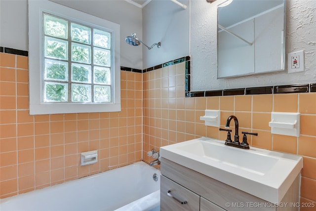 1417 Downing St, Oklahoma City, OK 73120 - bathroom featuring bathtub / shower combination, vanity, and tile walls