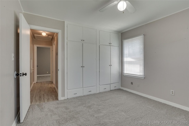 1417 Downing St, Oklahoma City, OK 73120 - unfurnished bedroom featuring carpet floors, a ceiling fan, and a closet