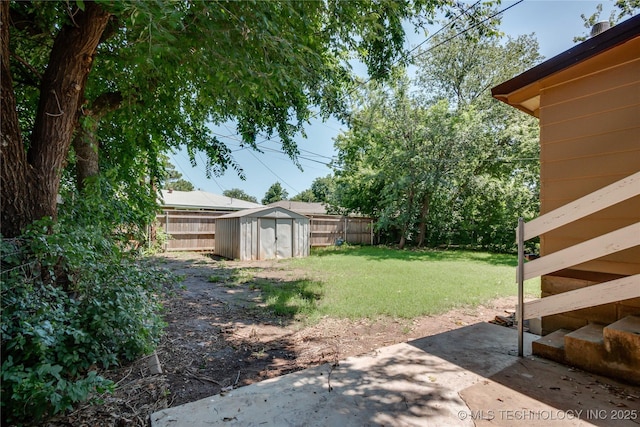 1417 Downing St, Oklahoma City, OK 73120 - fenced backyard featuring a shed and a patio area