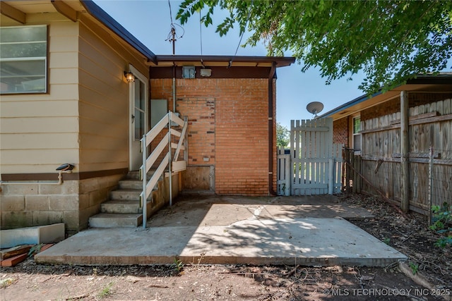 1417 Downing St, Oklahoma City, OK 73120 - property entrance with a gate and brick siding