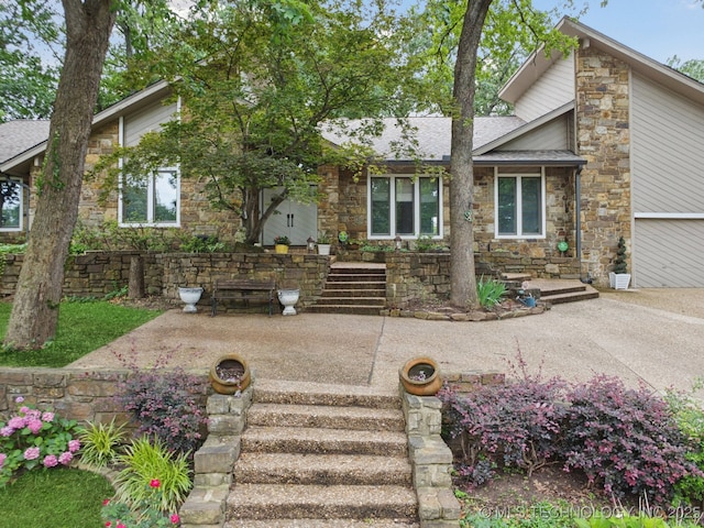 3334 E 100th Pl, Tulsa, OK 74137 - mid-century modern home with stone siding and roof with shingles