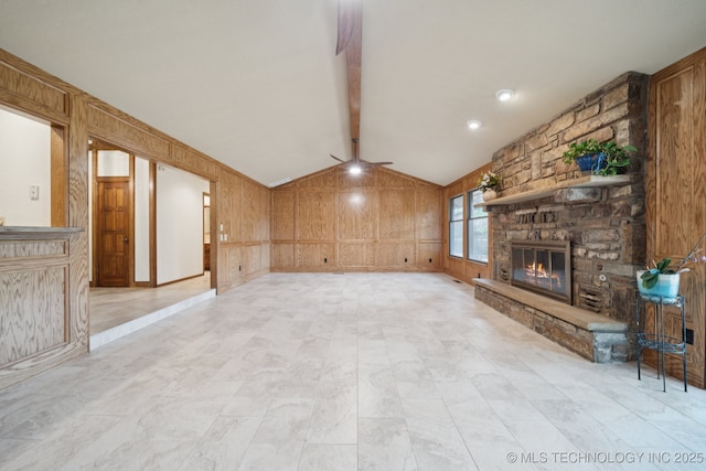 3334 E 100th Pl, Tulsa, OK 74137 - unfurnished living room featuring a ceiling fan, a fireplace, wooden walls, and a decorative wall