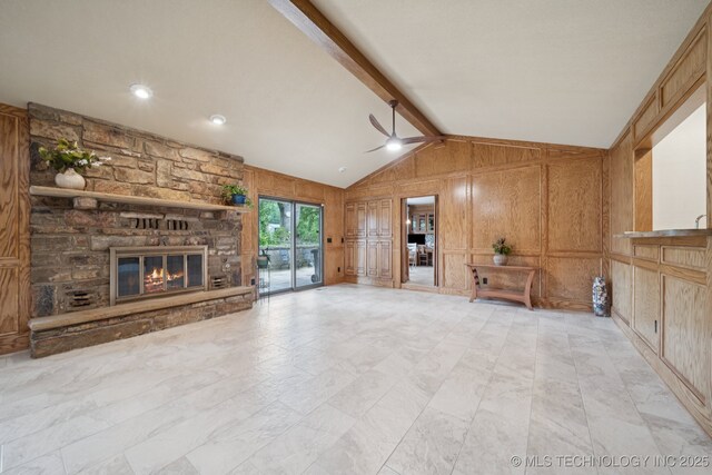 3334 E 100th Pl, Tulsa, OK 74137 - unfurnished living room featuring a ceiling fan, a stone fireplace, wooden walls, and a decorative wall