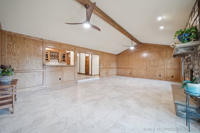 3334 E 100th Pl, Tulsa, OK 74137 - unfurnished living room with wood walls, ceiling fan, a decorative wall, and a stone fireplace
