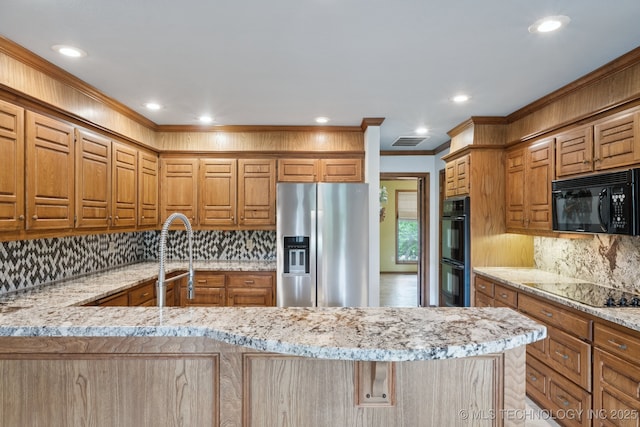 3334 E 100th Pl, Tulsa, OK 74137 - kitchen featuring black appliances, decorative backsplash, recessed lighting, light stone counters, and crown molding