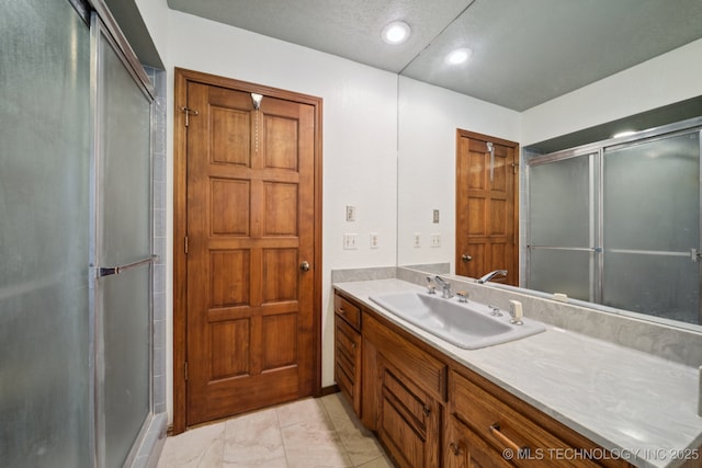 3334 E 100th Pl, Tulsa, OK 74137 - full bathroom with vanity, a stall shower, and recessed lighting