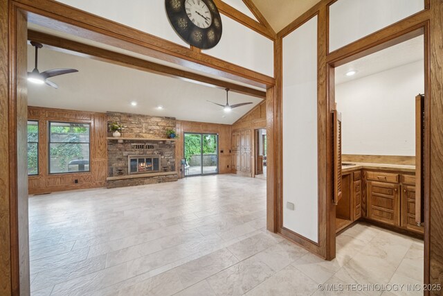 3334 E 100th Pl, Tulsa, OK 74137 - unfurnished living room with a ceiling fan, a fireplace, wood walls, high vaulted ceiling, and recessed lighting
