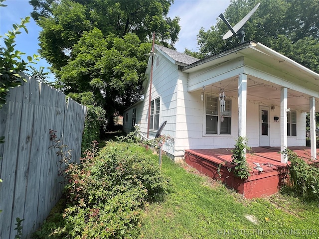106 N Jordan St, Cleveland, OK 74020 - view of home's exterior featuring covered porch