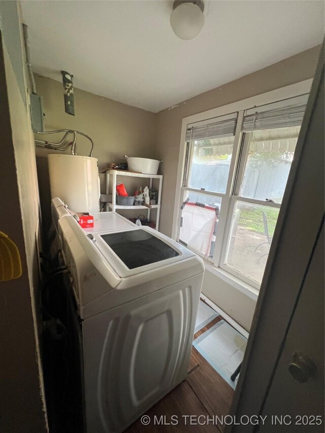 106 N Jordan St, Cleveland, OK 74020 - washroom featuring wood finished floors and washer and clothes dryer