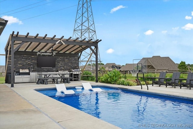 7107 E 88th St N, Owasso, OK 74055 - outdoor pool with exterior kitchen, a ceiling fan, and a patio