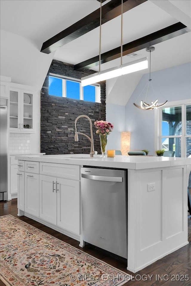 7107 E 88th St N, Owasso, OK 74055 - kitchen with stainless steel appliances, a chandelier, backsplash, beamed ceiling, and white cabinetry