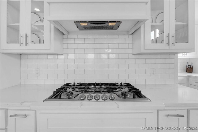 7107 E 88th St N, Owasso, OK 74055 - kitchen featuring stainless steel gas cooktop, white cabinets, and glass insert cabinets