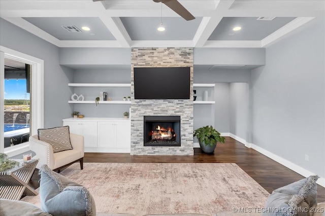 7107 E 88th St N, Owasso, OK 74055 - living area with coffered ceiling, wood finished floors, a fireplace, ceiling fan, and beamed ceiling