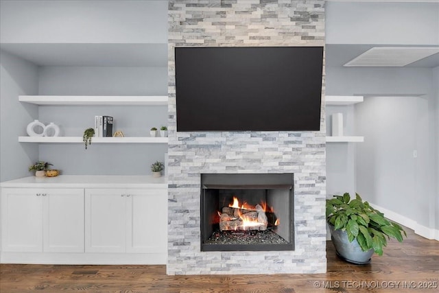 7107 E 88th St N, Owasso, OK 74055 - detailed view of a stone fireplace and wood finished floors