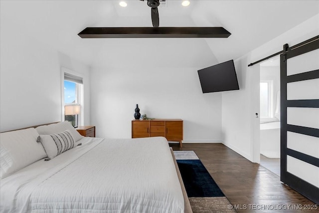 7107 E 88th St N, Owasso, OK 74055 - bedroom featuring a barn door and wood finished floors