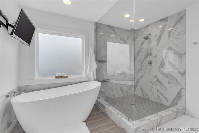 7107 E 88th St N, Owasso, OK 74055 - full bathroom with a freestanding tub, a marble finish shower, and recessed lighting