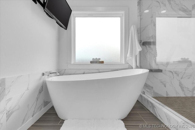 7107 E 88th St N, Owasso, OK 74055 - bathroom with a freestanding tub and tile walls