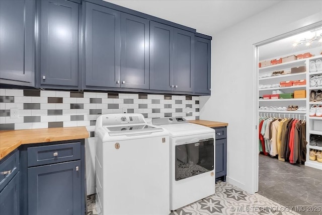 7107 E 88th St N, Owasso, OK 74055 - laundry room featuring cabinet space and washer and dryer