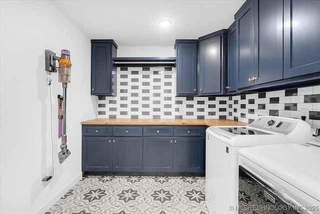 7107 E 88th St N, Owasso, OK 74055 - laundry area featuring cabinet space, separate washer and dryer, and light floors