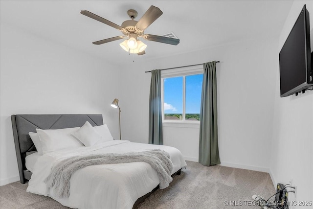 7107 E 88th St N, Owasso, OK 74055 - bedroom with light colored carpet and ceiling fan